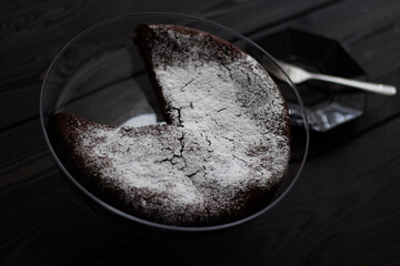 Brownie chocolate cake on dark table