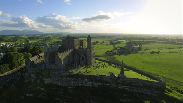 Panning aerial, castle ruins in small Irish town