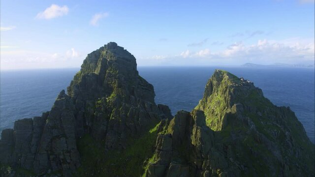 Pan right aerial, island mountain ridge in Ireland