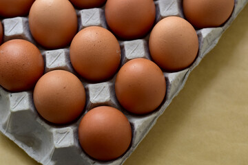 Close up Raw Brown Chicken Eggs, Easter eggs In Paper Container, selective focus points.