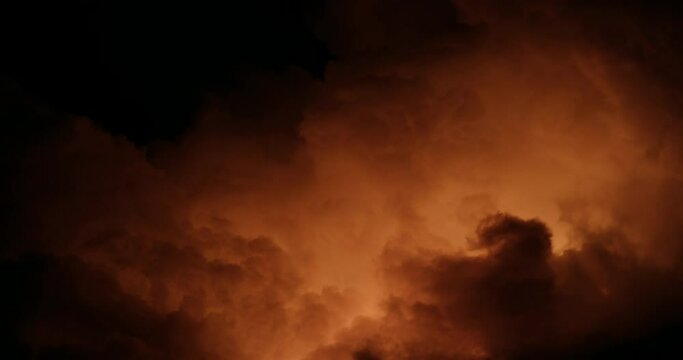 Smoke from lava flow against night sky, wide