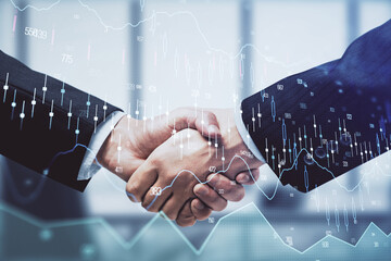Double exposure of forex graph hologram and handshake of two men. Stock market concept.