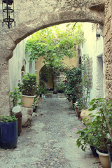 Naklejka premium The ancient streets of the ancient city in Greece. Authentic alleys of Rhodes.