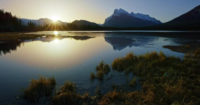 Sunset over mountain lake in Banff National Park, wide