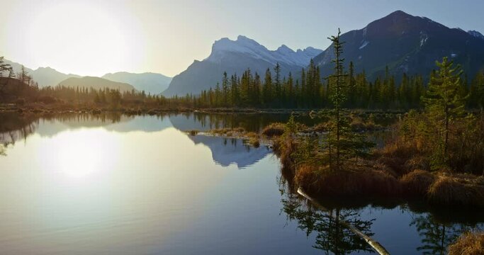 Wide, sunset over Banff National Park lake