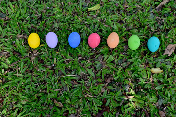 Closeup of Variety of colorful Easter eggs on grass at Thailand.
