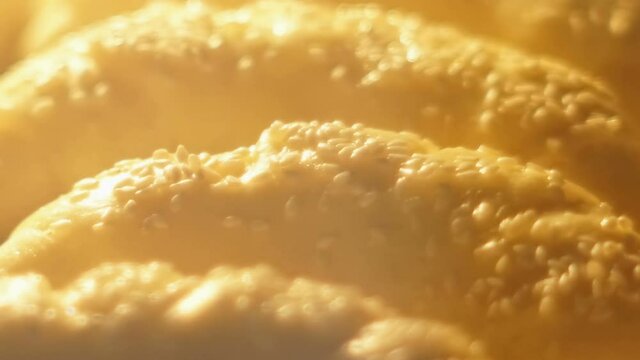 Closeup of Freshly baked croissants in the baking oven. Breakfast timelapse