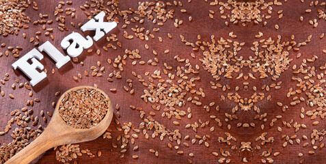 Linum usitatissimum - Brown flax seeds linseed in kitchen spoon