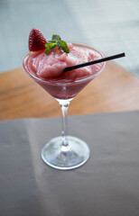 Drink with alcohol. Frozen strawberry cocktail. With sorbet and fruit.