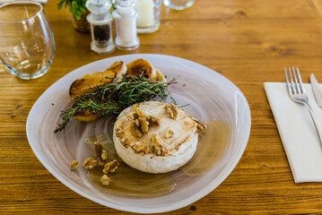 Provoleta with nuts and salad. Mediterranean dish from the island of Majorca.