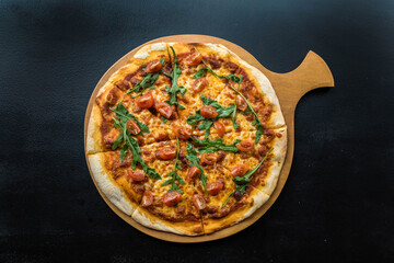 Pizza with ham, cheese and vegetables View from above.