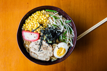 Asian food. Rice, corn, egg, soy, meat, wakame. Chinese sticks.