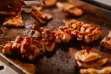 Delicious meat is baked in the kitchen of the restaurant. Preparing meat for guests