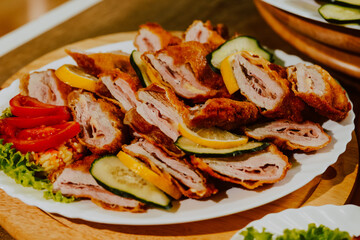 Served meat on the table for guests at the party. Delicious food for a special event
