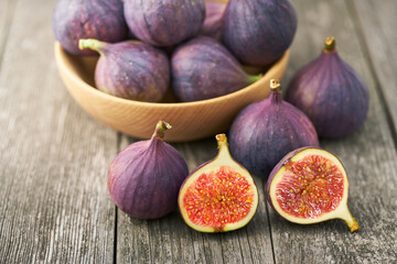 fresh figs on a wooden table , top view.