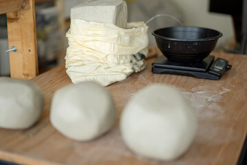 Weighting scales with the clay dough