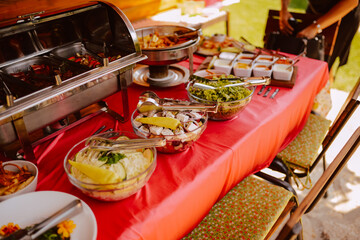 Table with food served on plates at the celebration. Snack for guests