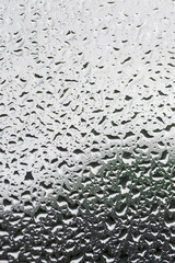 Background Abstract Texture Consisted of Water Droplets on Glass Surface.