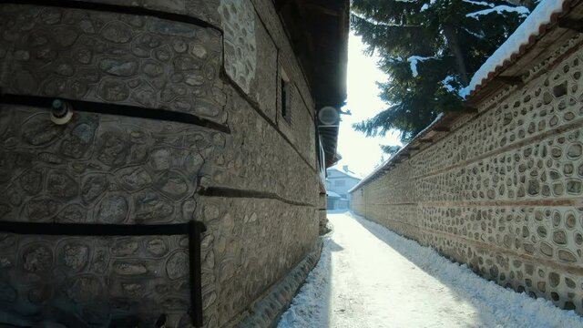 Traditional street alley at winter in Bansko town. Bulgaria