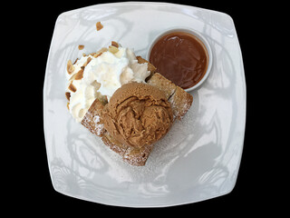 Top view toast with ice cream isolated on black background