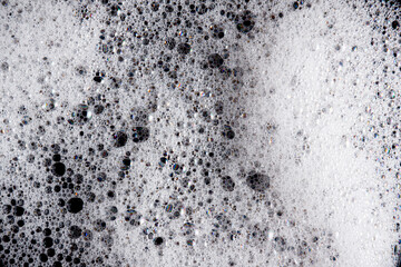 Abstract background white soapy foam texture. Shampoo foam with bubbles
