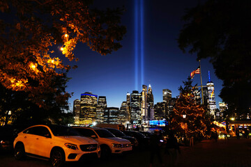 Obraz premium Sept 11, 2020 9/11 Memorial Lights next to a Christmas tree overlooking from Downtown Brooklyn, New York City, USA.