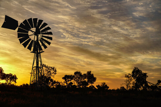 Central Australia windmill at sunset