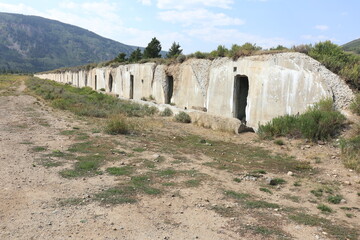 Fototapeta na wymiar Row of Abandoned Concrete Ordnance Bunkers