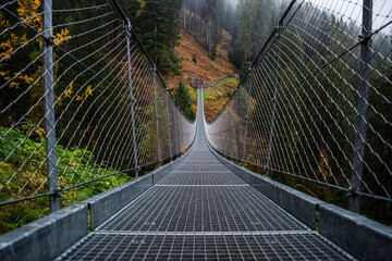 Fototapety  Suspended metal bridge.