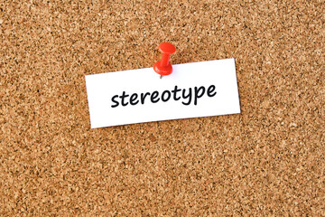 Stereotype. Word written on a piece of paper, cork board background.