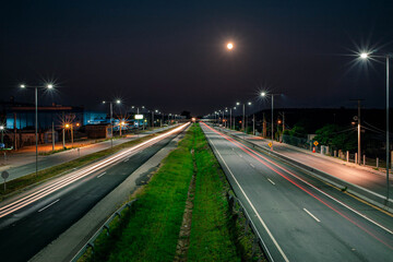 Fototapeta na wymiar night traffic, speed traffic - light trails at night