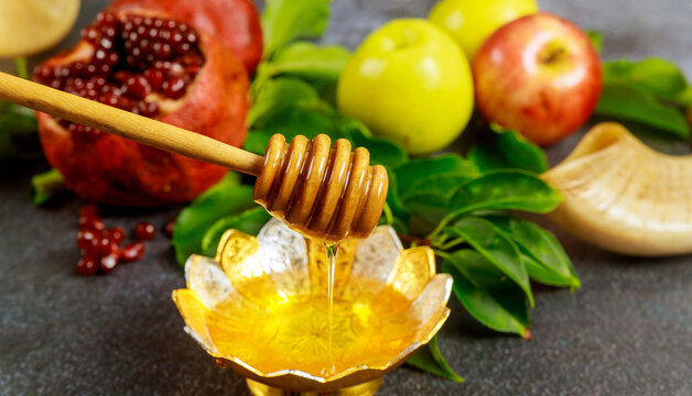 Silver bowl with honey and fruits for Yom Kippur.