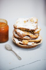 stack of pastries with icing sugar