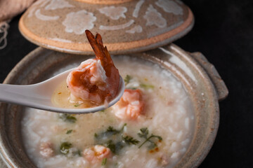 Shrimp Boiled Rice or Seafood Boiled Rice on black background.