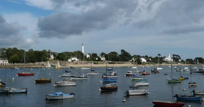 Combrit harbour, Finistere, Brittany, France. On the foreground is the traditional harbour of Combrit. In the background is Benodet