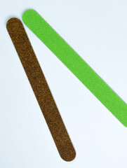 Manicure tools. Nail files isolated on a white background. The view from the top. Green nail file. Purple nail file.