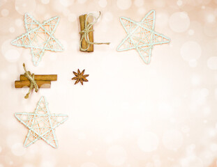 Christmas decorations: stars, toys, snowflakes. Flat lay on light background with bokeh