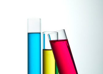 Set with different laboratory glassware and liquid for analysis on white background