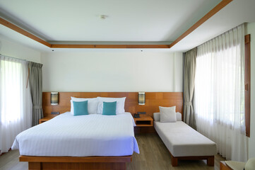 Interior of the bedroom with wooden furniture and wooden floor