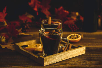 Cozy autumn drink. Hot mulled wine with oranges and spices.