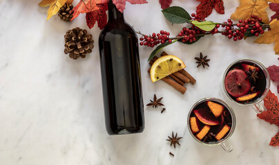 Hot holiday drink mulled wine with oranges, gloves, anise stars, and cinnamon.