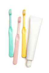 Tooth brushes and paste on white background