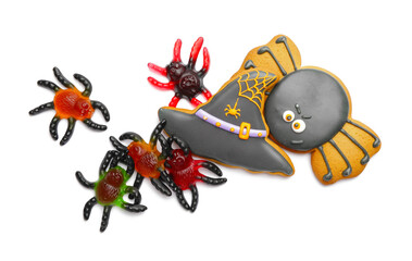 Tasty scary candies and cookies for Halloween on white background