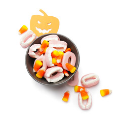 Tasty scary candies for Halloween on white background