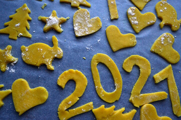 Shortbread liver of various shapes on a baking tray. 2021, christmas