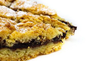 Tasty cake with powder sugar on top and plum stuff