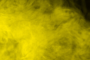 Fototapeta na wymiar Yellow steam on a black background.