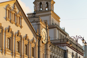Fototapeta premium Moscow cityscape at autumn sunset after the rain. Building of the Moscow Kazansky railway station. Big old city clocks. Traveling theme.