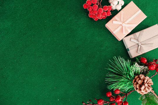 Christmas composition frame for text. Flat lay, top view - greeting card template christmas and New Year. Christmas decorations on a green background