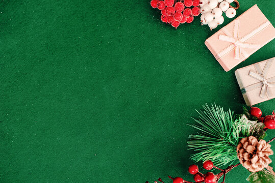 Christmas composition frame for text. Flat lay, top view - greeting card template christmas and New Year. Christmas decorations on a green background